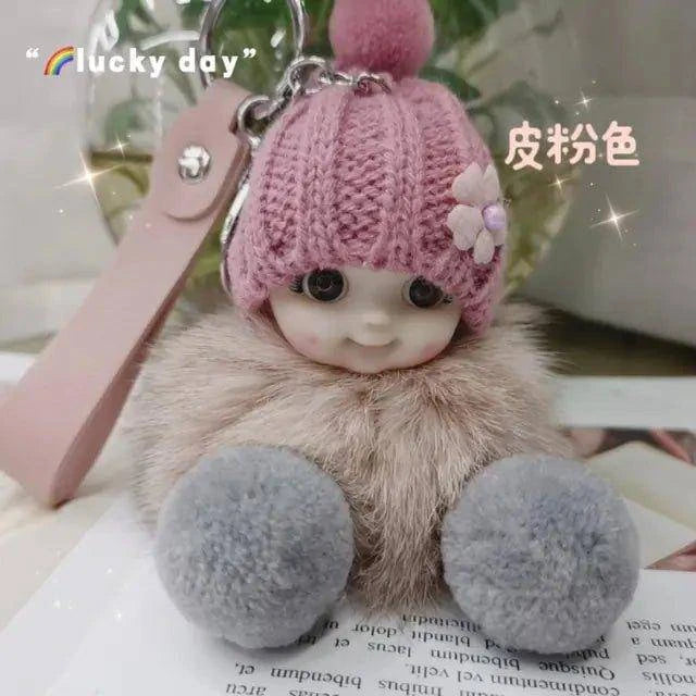 Add Charm to Your Belongings with the Cute Expression Face Baby Pompom Keychain! - Home Kartz